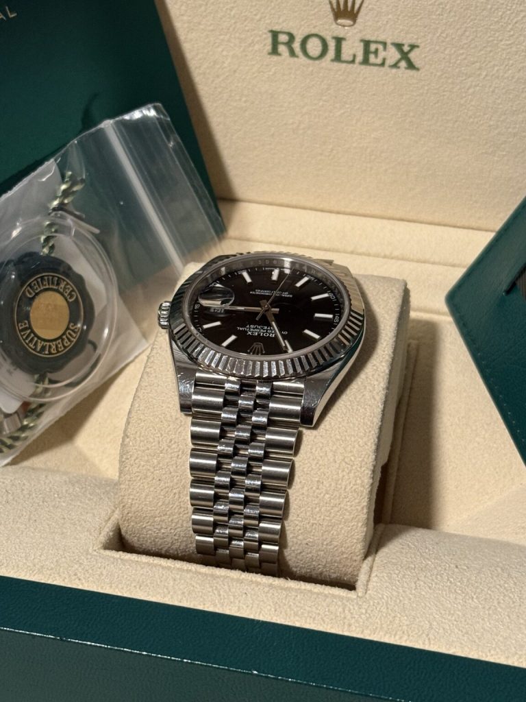 Rolex Datejust 41 displayed with Lily International Timepieces card